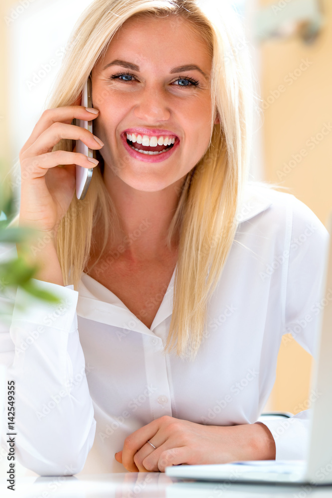 Young woman talking on the phone