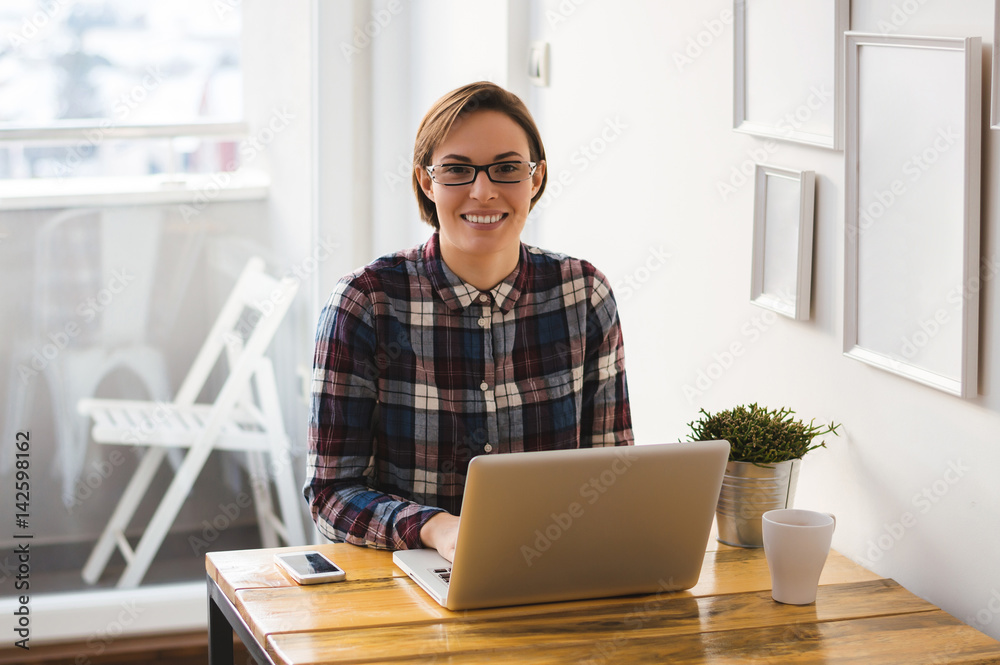 Shorthaired girl wearing glasses