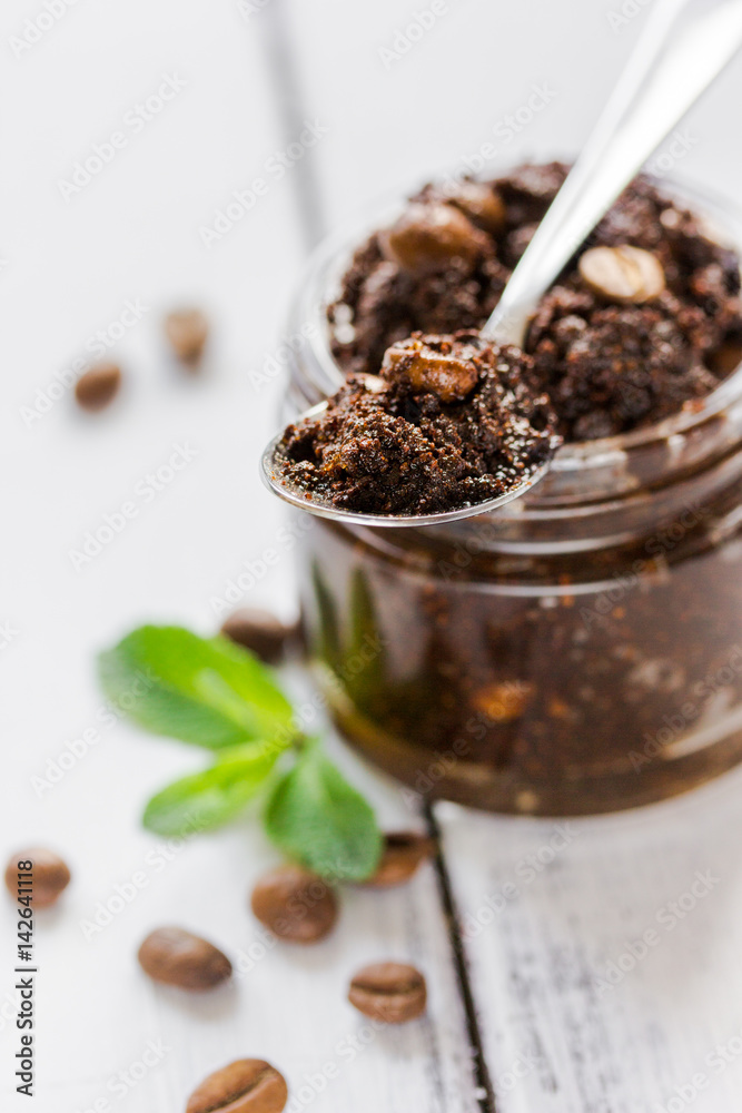 Organic scrub from ground coffee on wooden table background