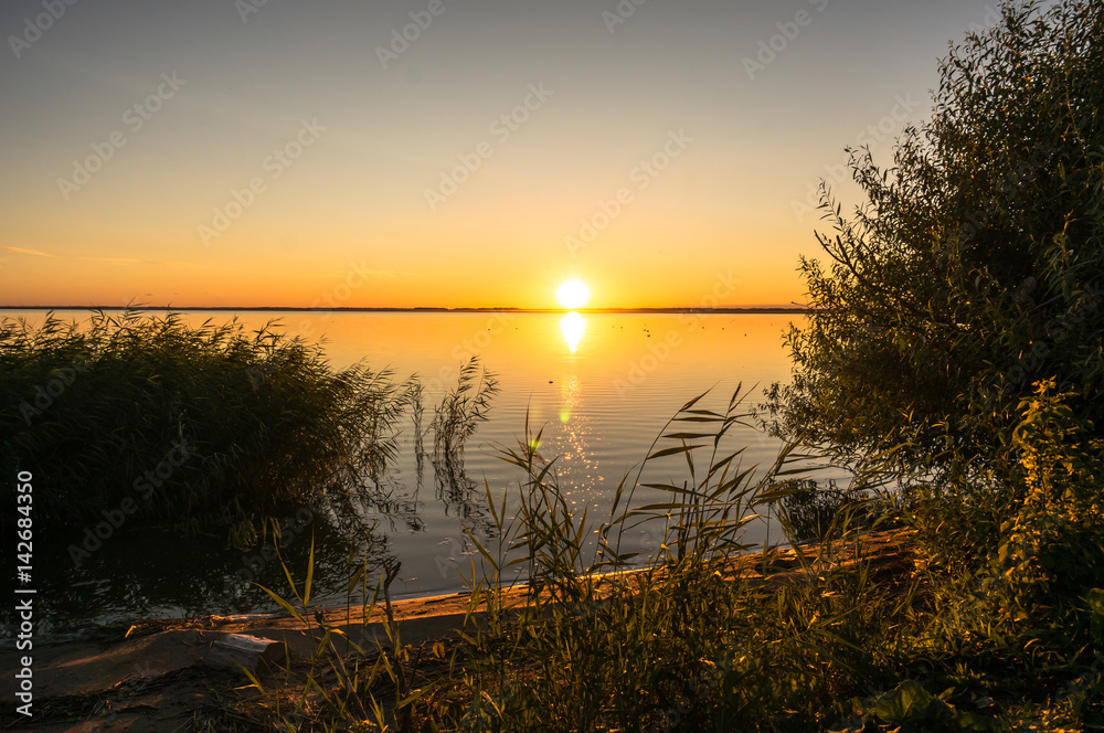 Beautiful Evening landscape with lake, silhouette tree and bushes during sunset.Bhopal India