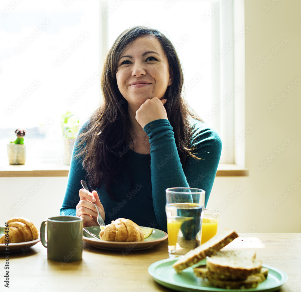 Caucasian Woman Eating Breakfast Pyjamas