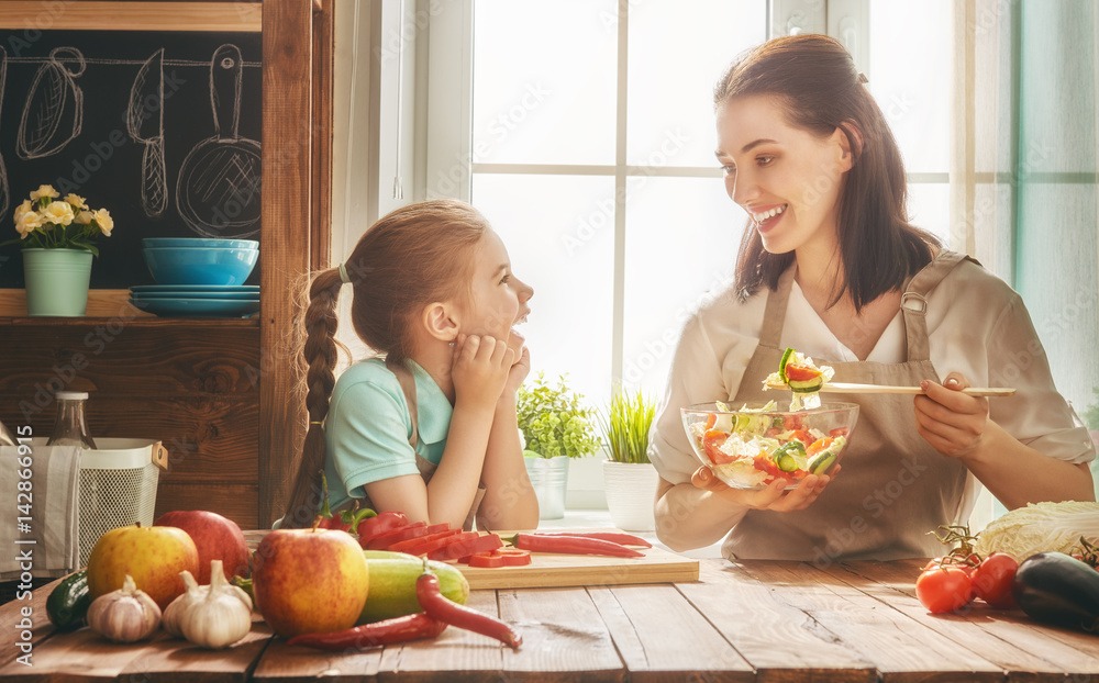 Happy family in the kitchen.