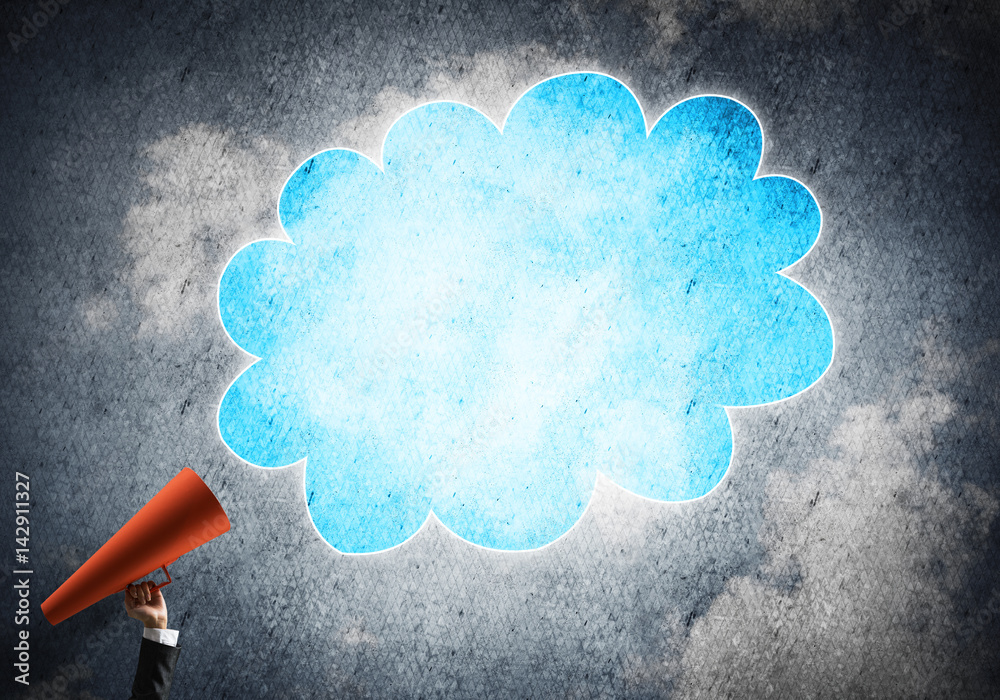 Hand of businesswoman holding red paper trumpet and speech cloud