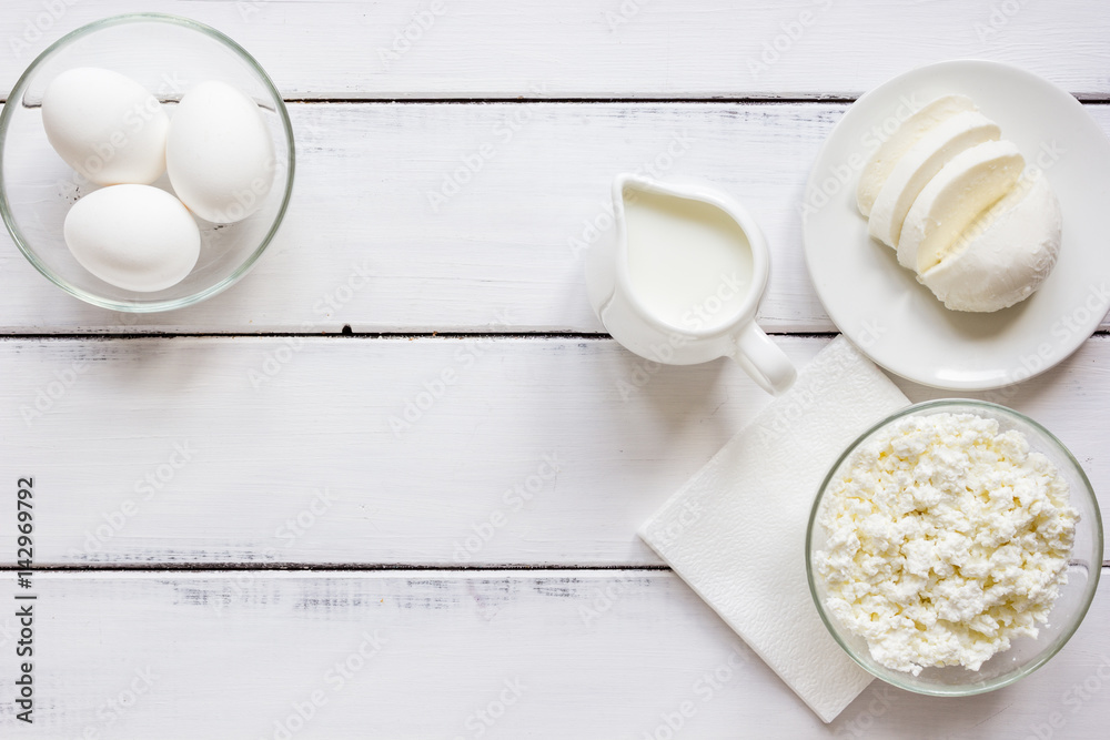 monochrome concept with dairy products on white table top view mock up