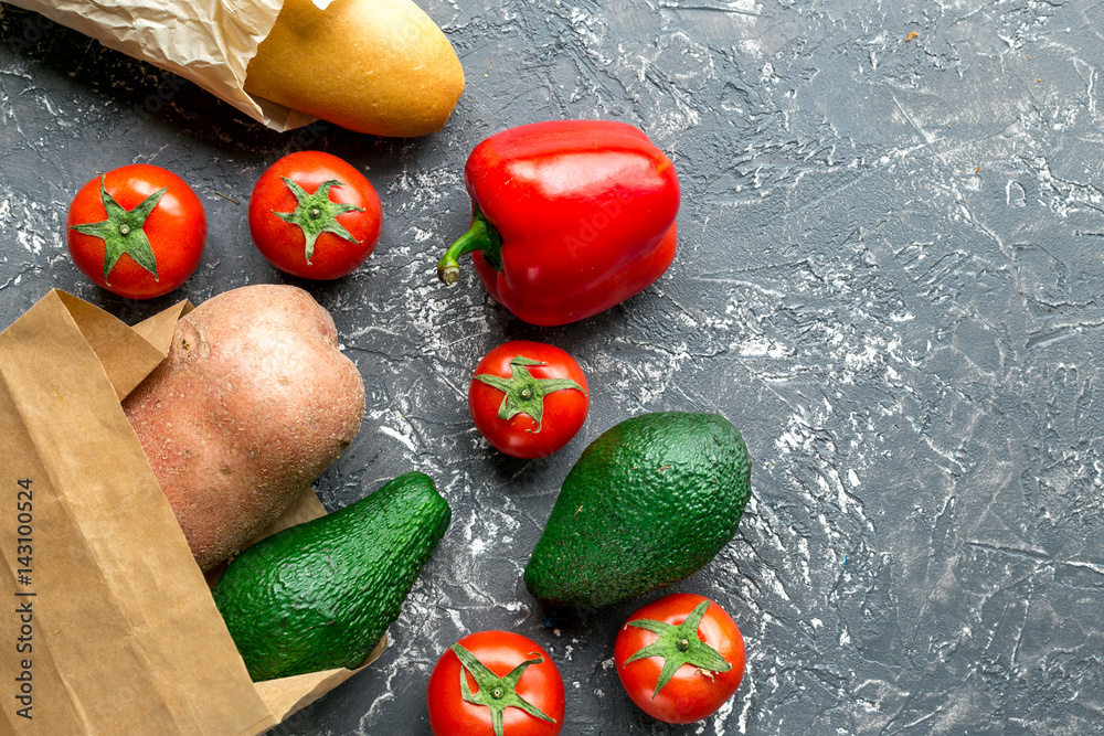 food set with vegetables and paper bag on table background top view mock-up