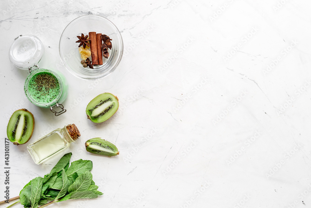 body scrub with kiwi in cosmetics concept white background top view mockup