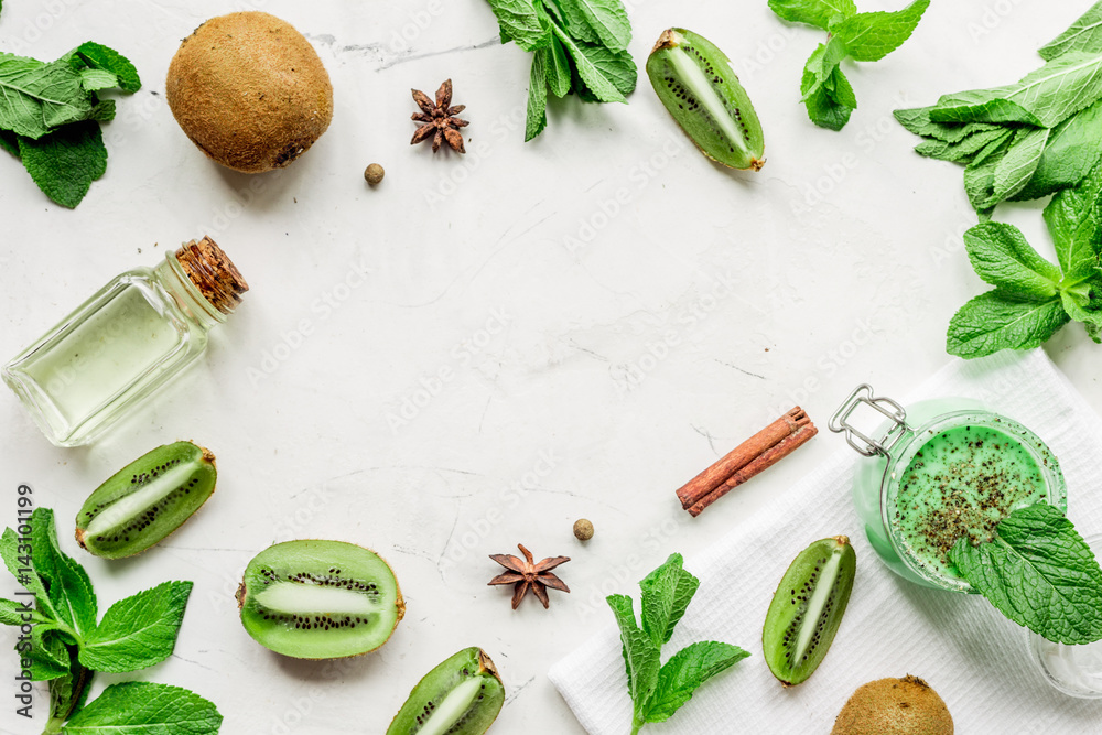 Cosmetic for body with kiwi scrub table background top view mockup