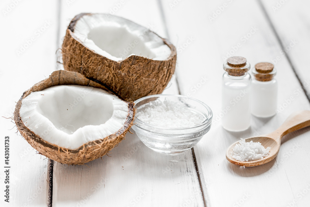 organic cosmetics with coconut on white background