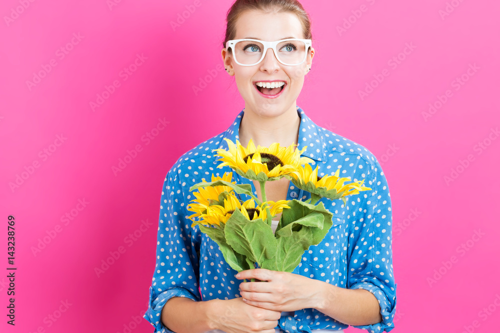 Young woman with sunflowers