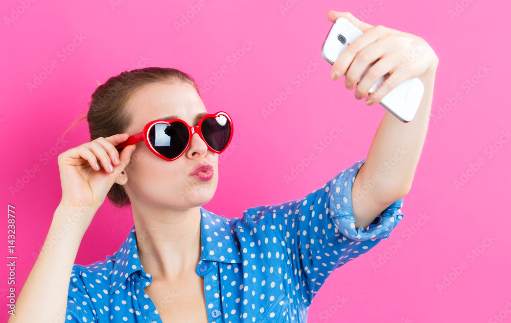 Young woman taking a selfie