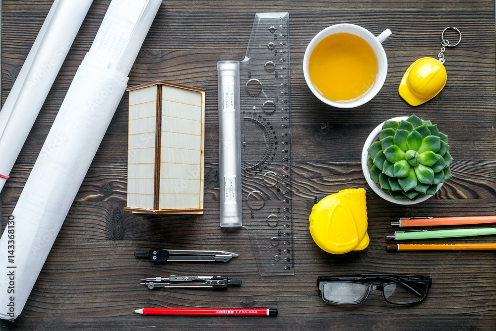 profession concept with architect desk and tools wooden background top view