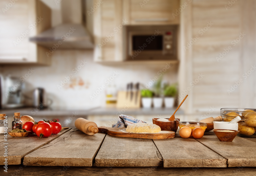 Baking ingredients placed on wooden table