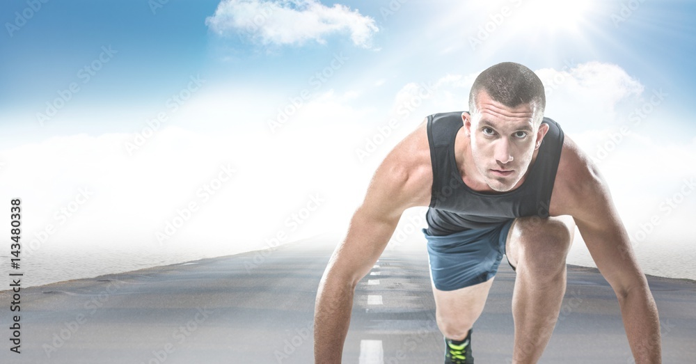 Male runner on road against sky and sun with flare