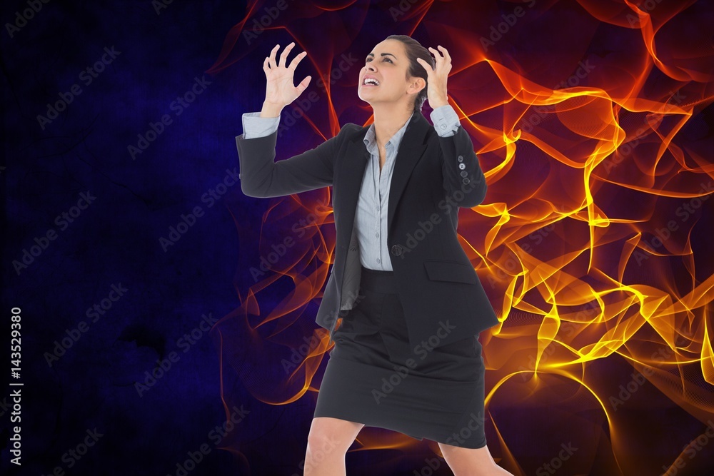 Digital composite image of angry businesswoman with fire