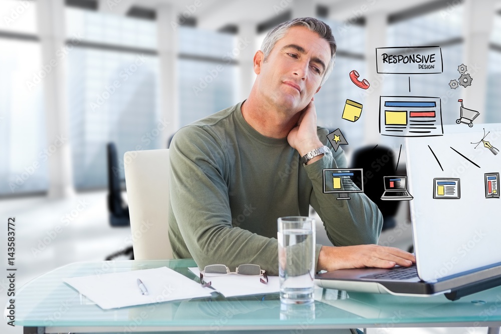 Businessman using laptop with icons 