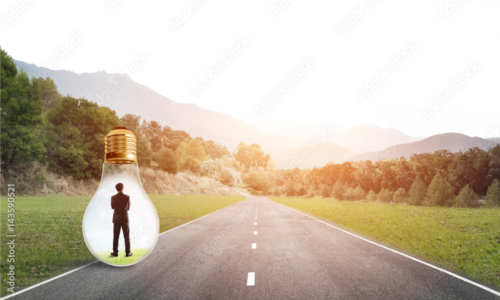 Businessman inside light bulb