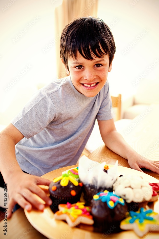 Happy boy eating colorful confectionery