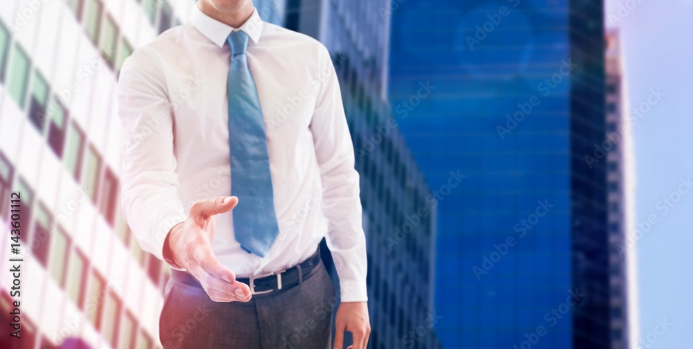 Composite image of smiling businessman offering handshake