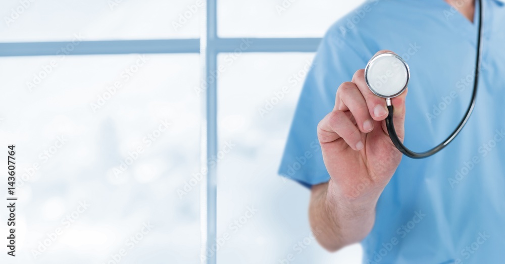 Doctor at the hospital with the stethoscope