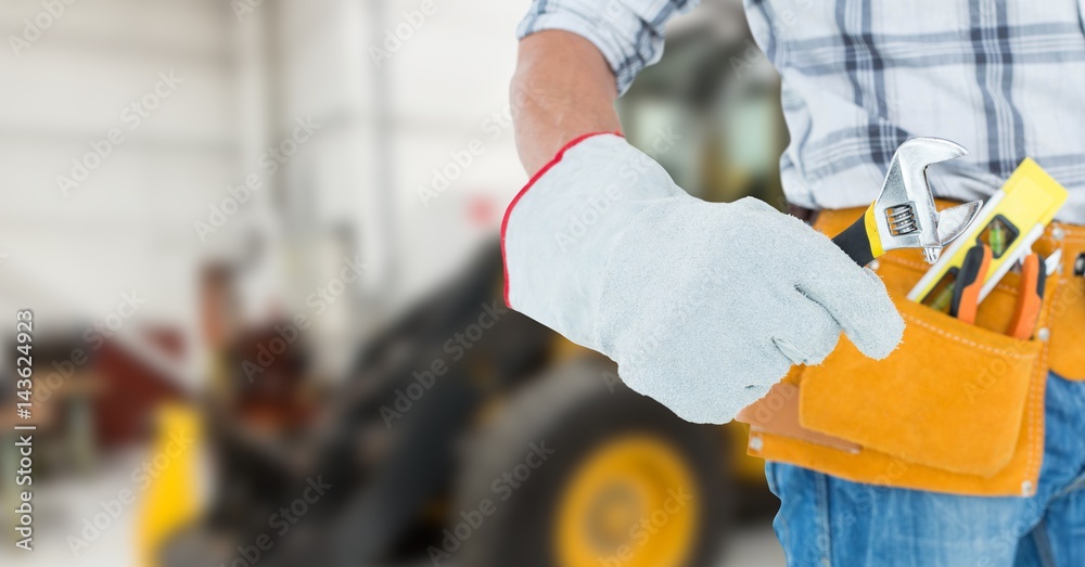 builder with his tools with blurred background