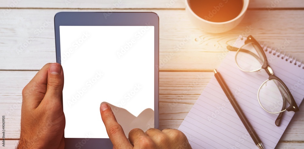 Cropped image of person using tablet