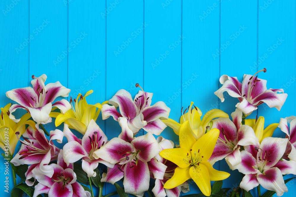  lily flowers on wooden planks