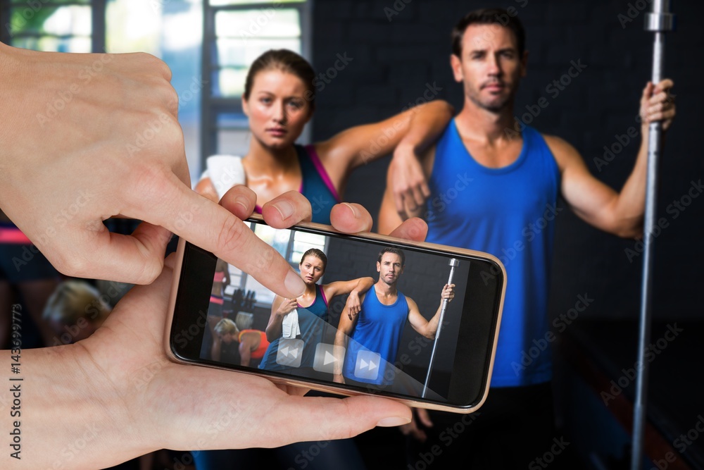 Composite image of portrait of fit serious friends in gym