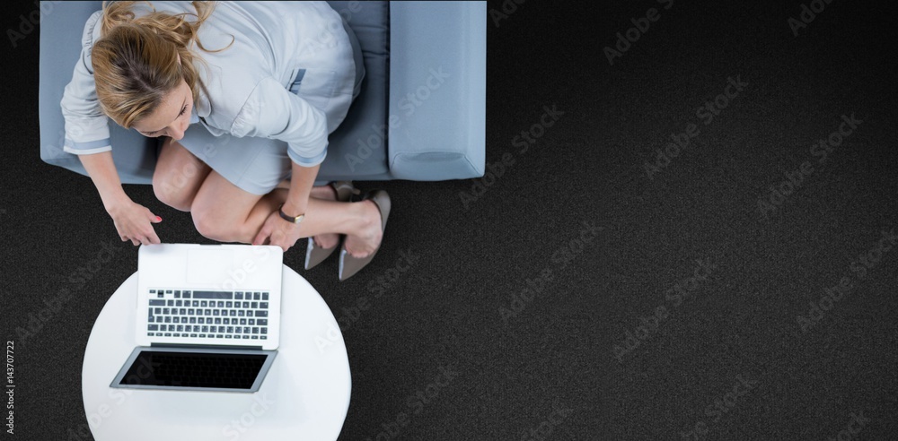 Composite image of woman on her laptop