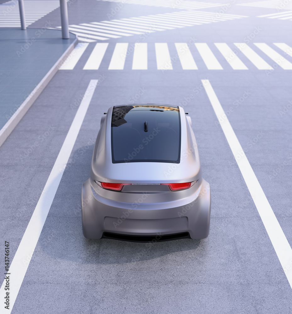 Rear view of autonomous vehicle waiting at intersection. 3D rendering image.