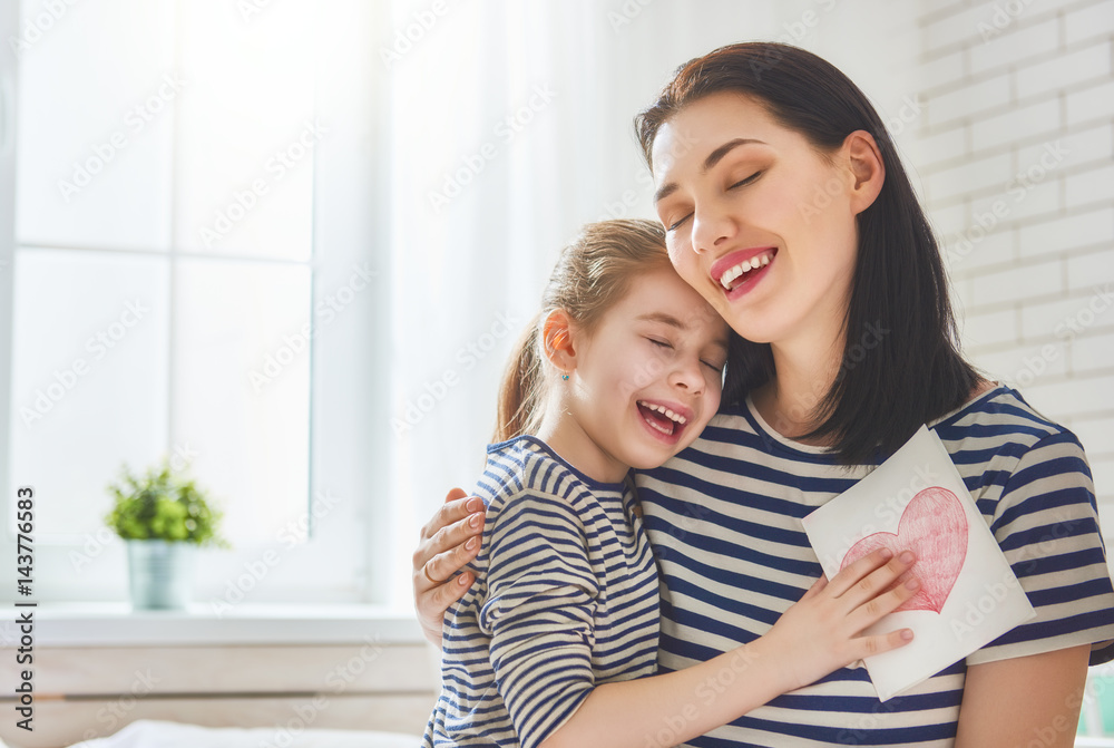 daughter congratulates mom