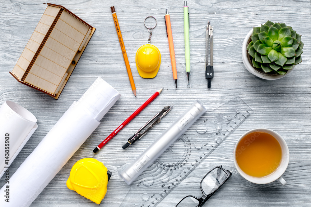 Architects workplace with tools on light wooden background top view