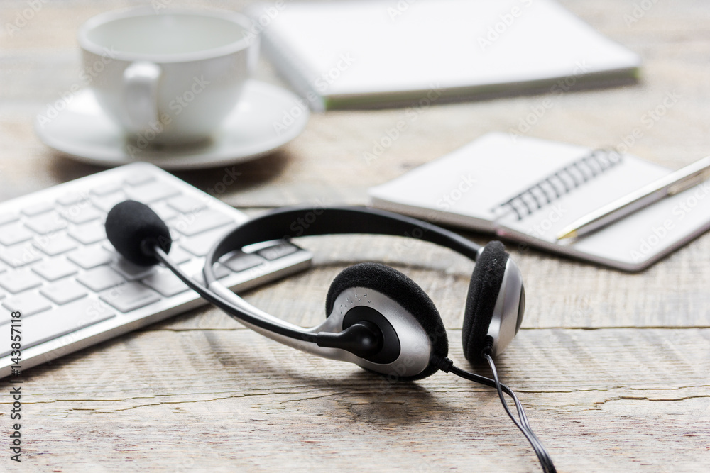 Call center support table with headset and keyboard