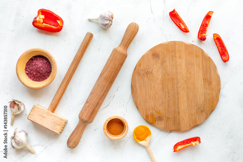 composition of cooking tools and spices on kitchen table top view