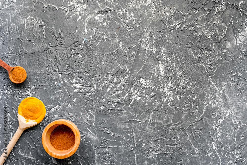 Professional kitchen with spices for cook on gray background top view mock-up