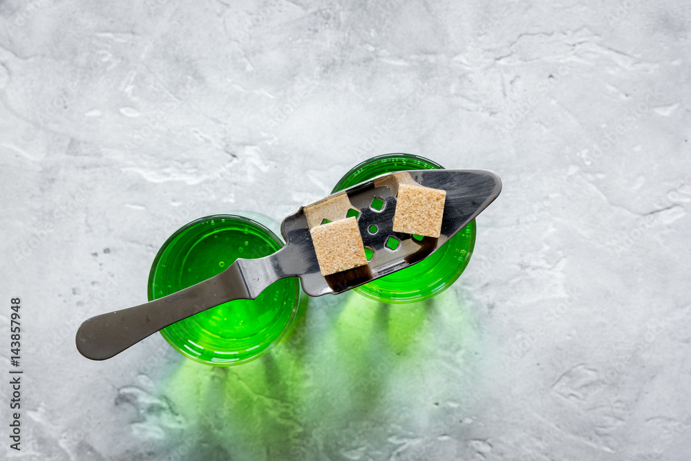 absinthe shots with sugar cubes stone table background top view mock up