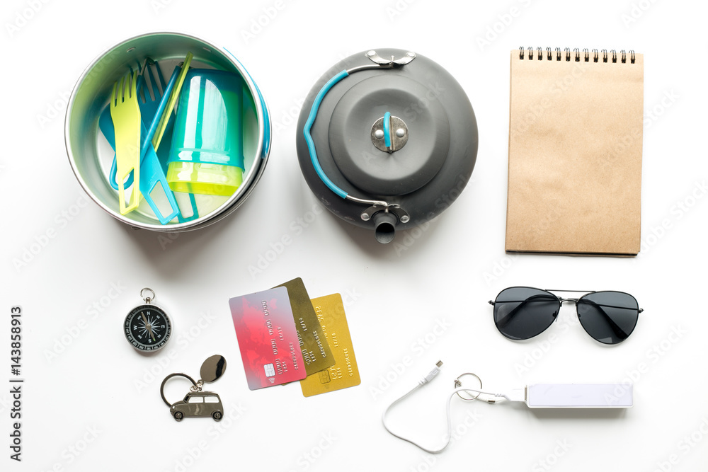 Preparation for traveling with loudspeaker and sunglasses on white background top view