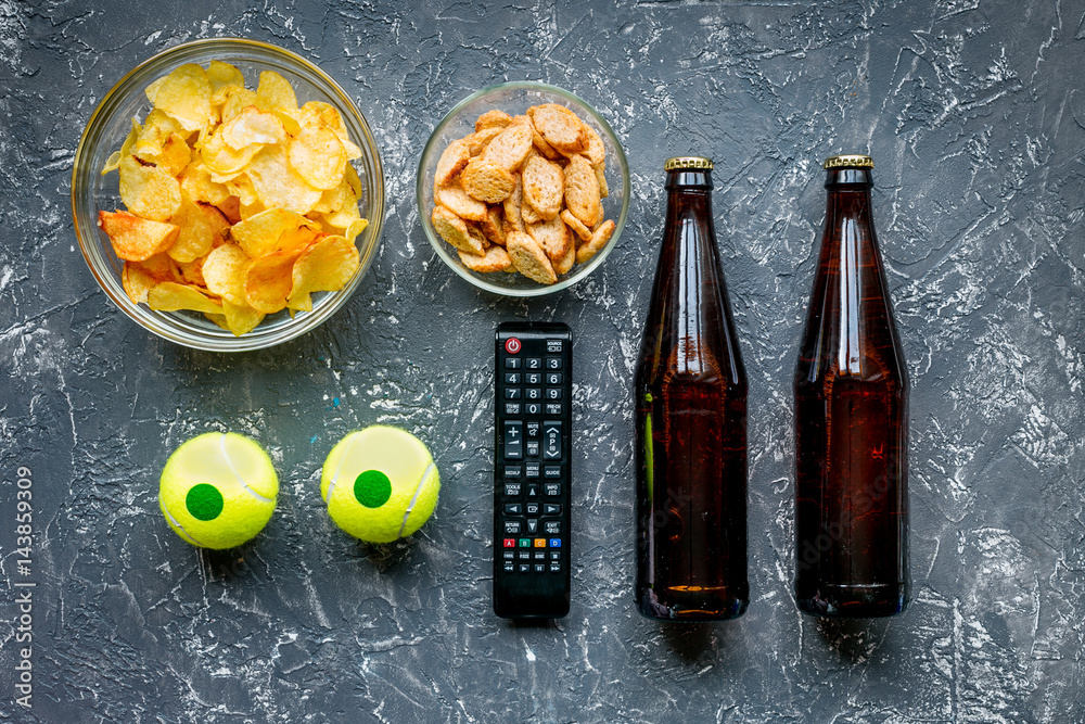 snacks for watching sport match on dark background top view