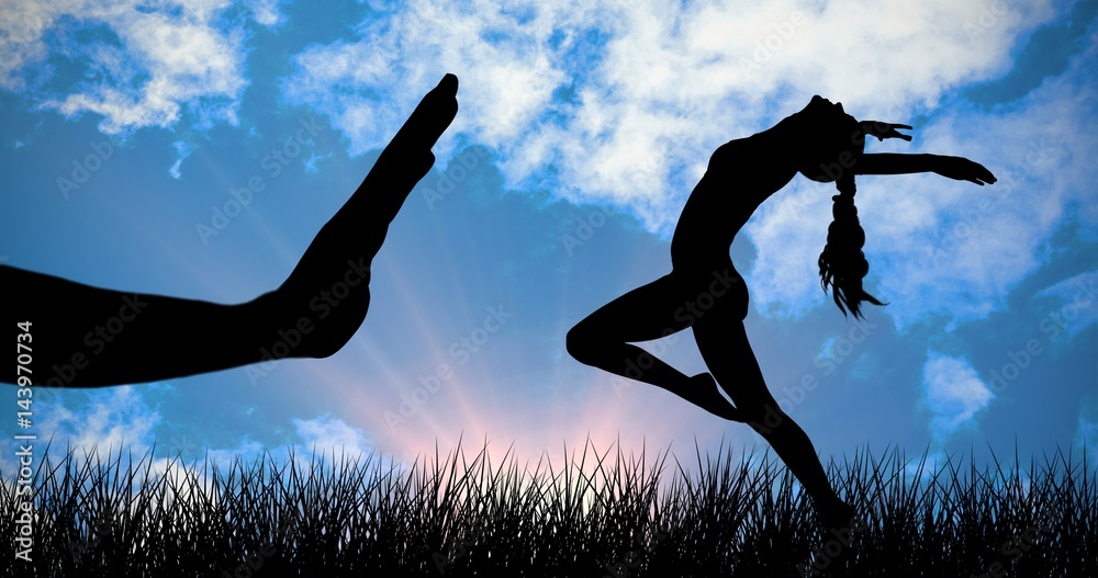 Composite image of side view of a sporty young woman stretching