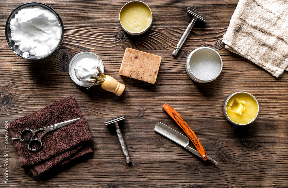 babrer workplace with tools on wooden background top view