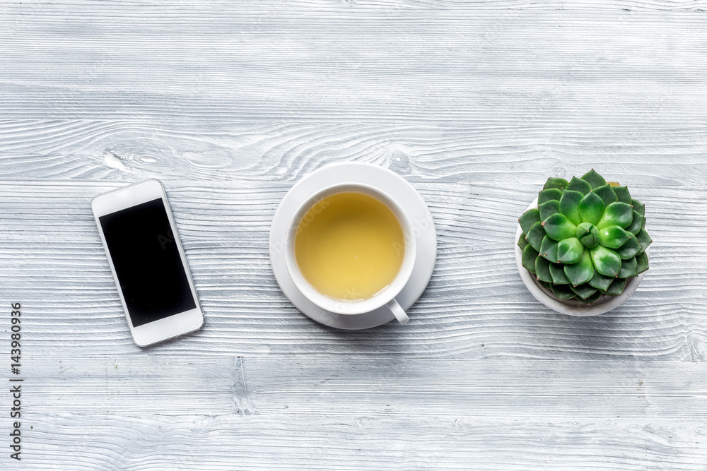 home office with flowers spring concept on wooden background top view mockup