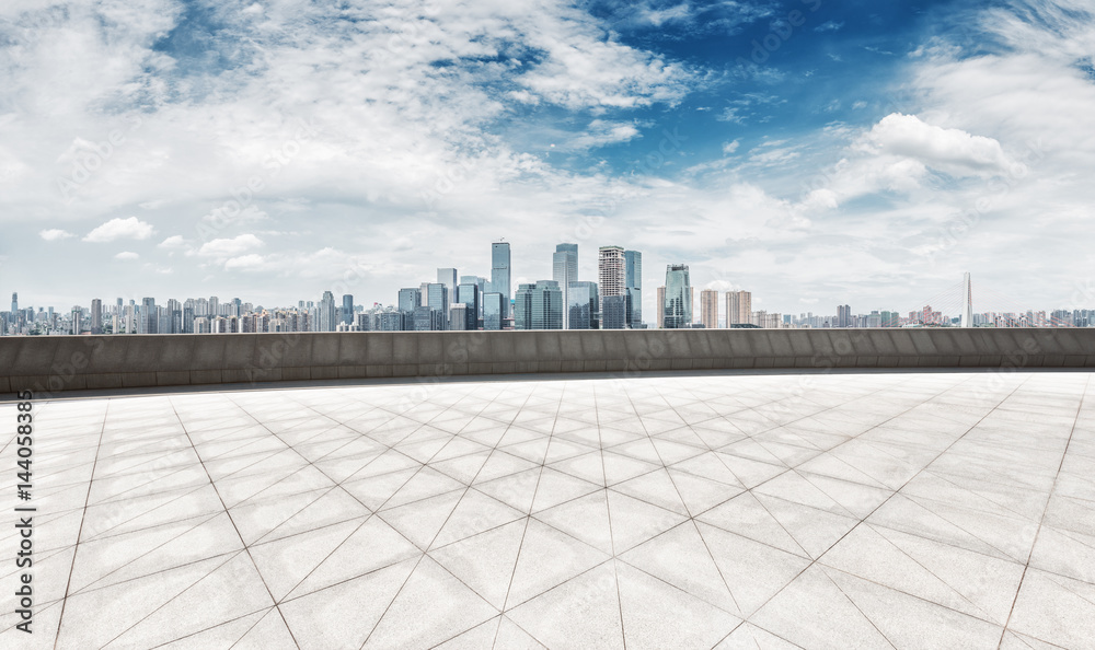 empty brick floor with cityscape of modern city