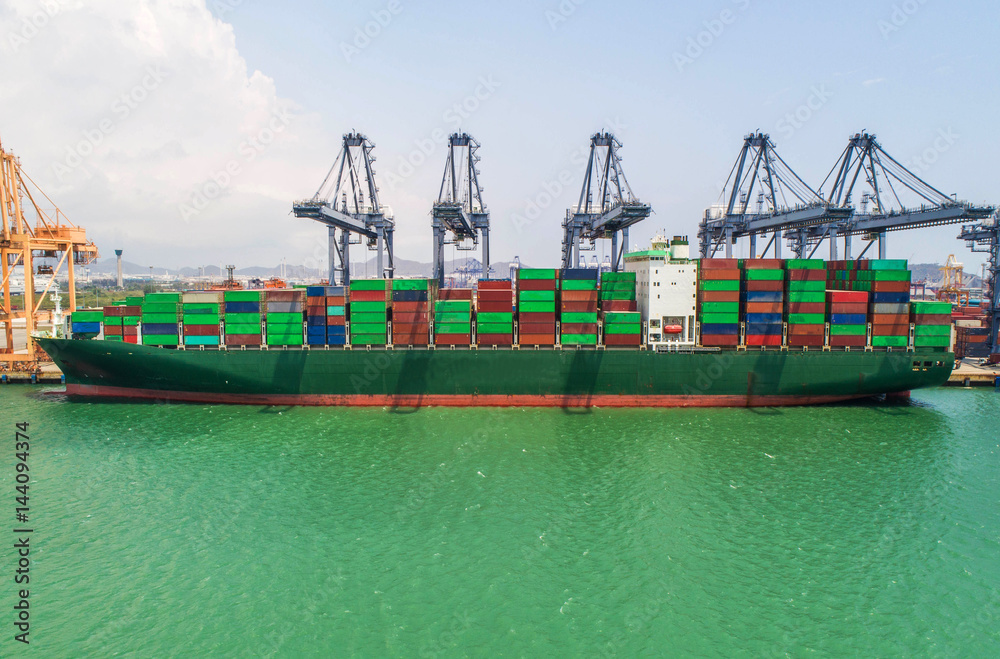 container ship in import export and business logistic.By crane ,Trade Port , Shipping, cargo to harb