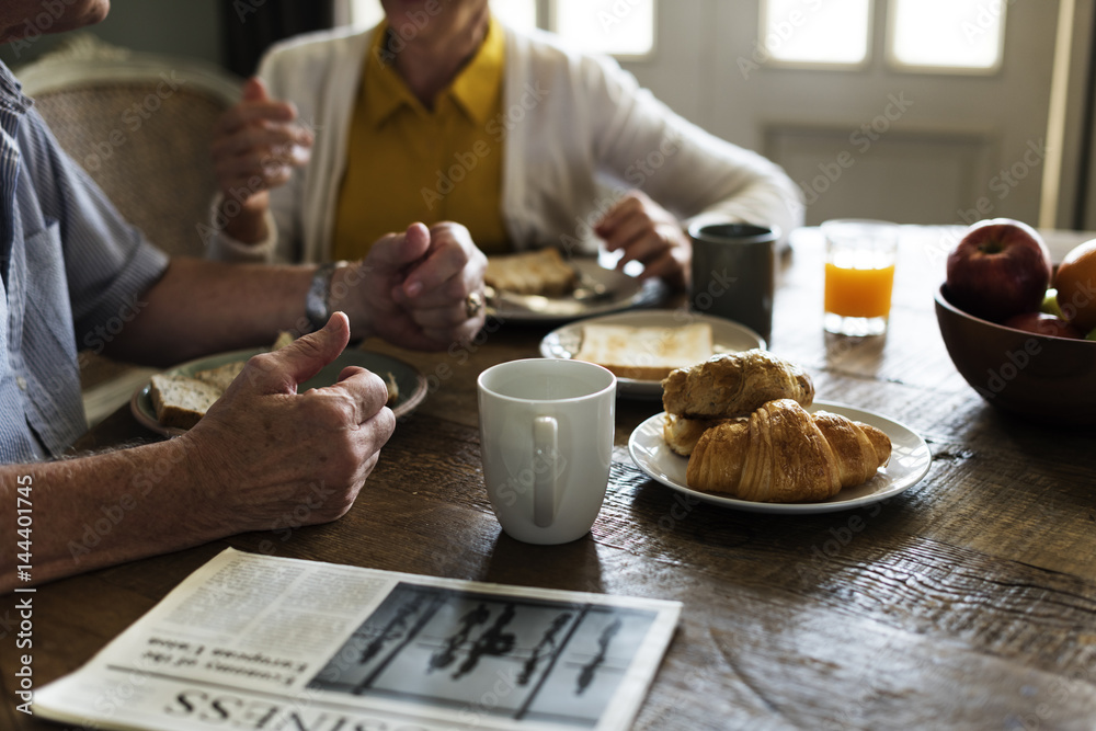 Senior Adult Couple Eat Breakfast