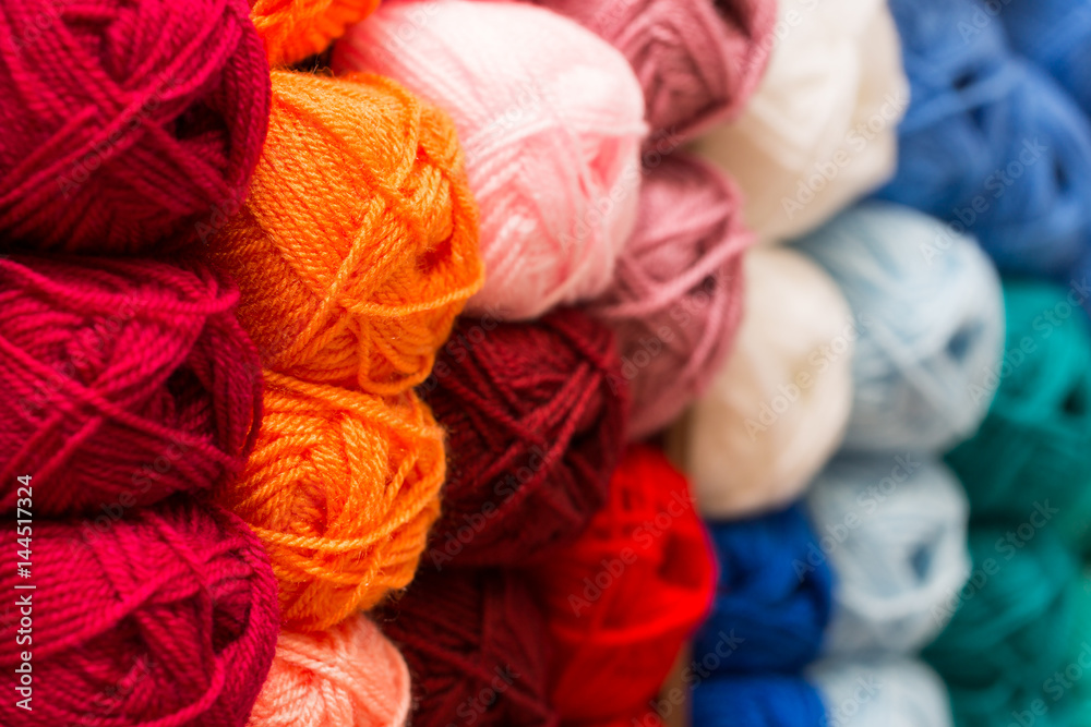 closeup of colorful wool yarn balls in knitting store