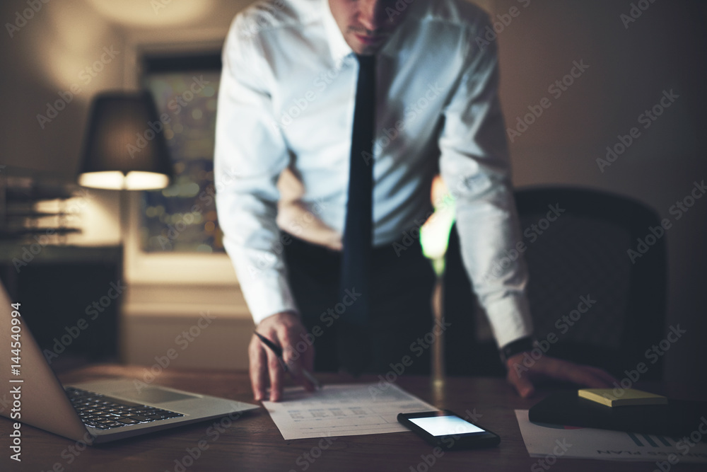 The accountant working with papers in office