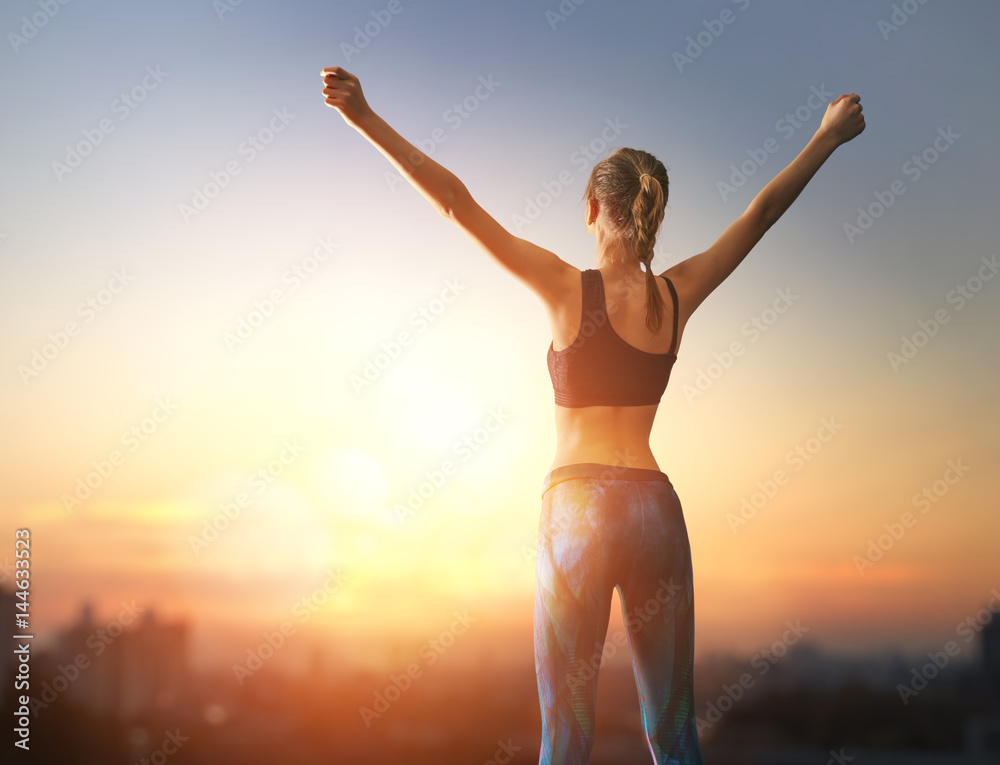 Girl with raised hands