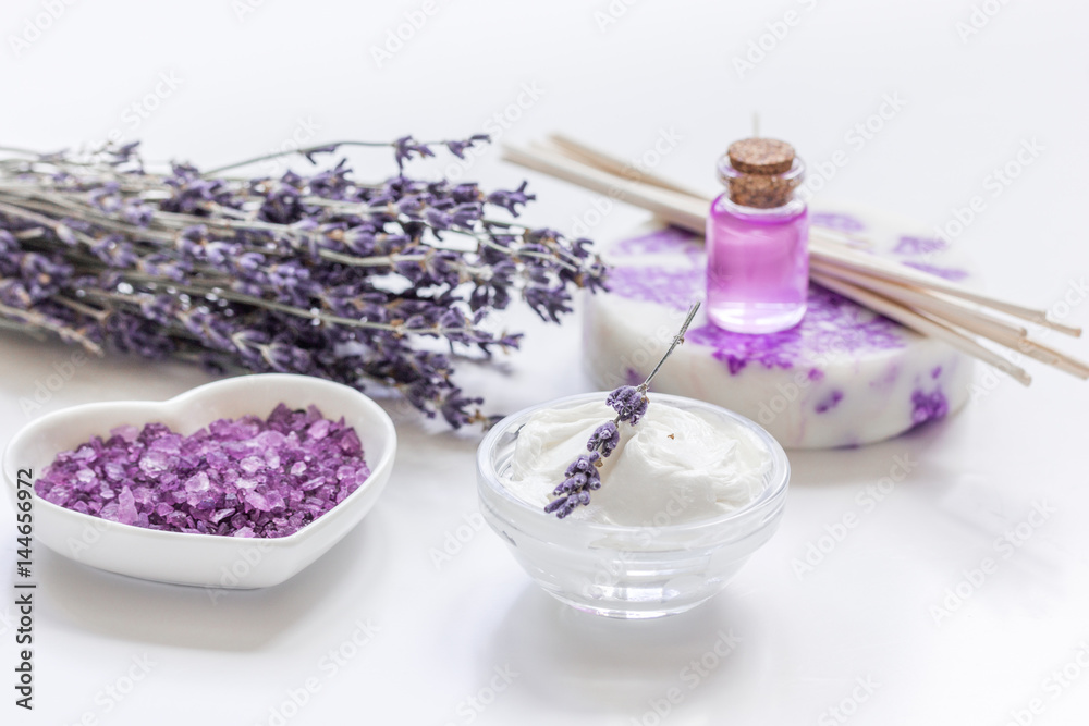 lavender flowers in organic cosmetic set on white background