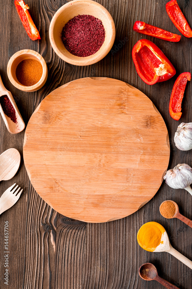 cook work with kitchenware set on dark background top view