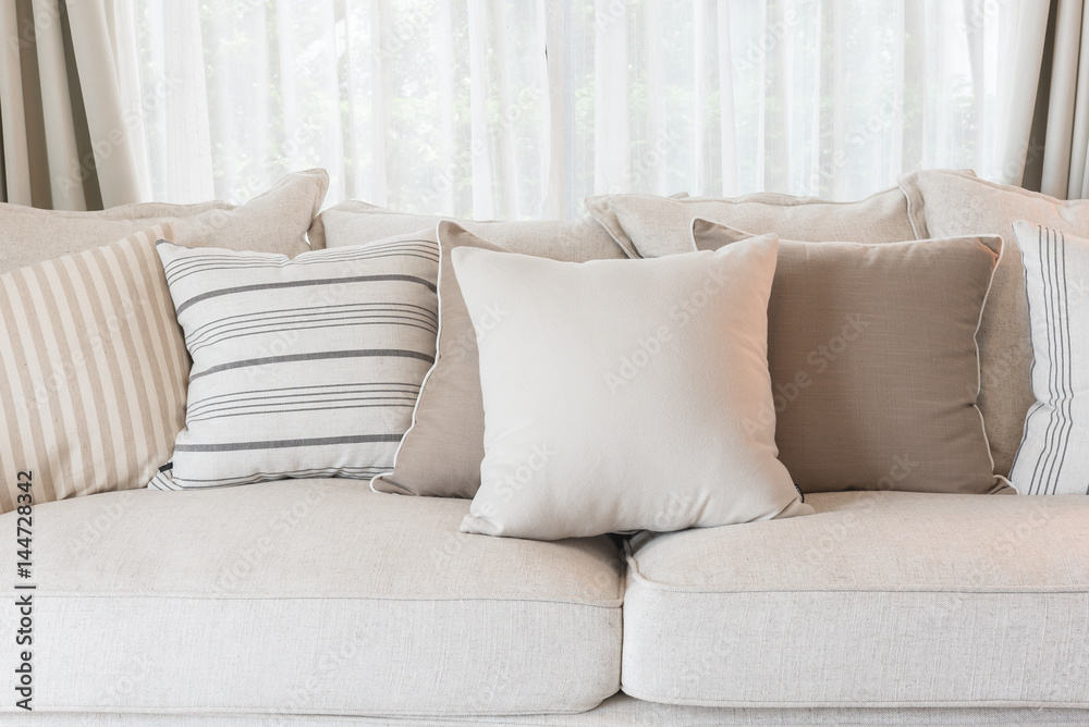 set of pillows on classic sofa in modern living room