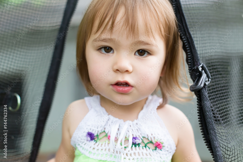 Close up of toddler girl on her trampoline